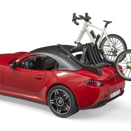 Roadster with 1 Road Bike and Female Cyclist