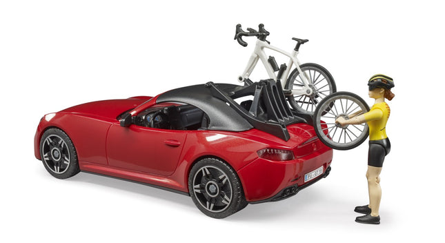 Roadster with 1 Road Bike and Female Cyclist